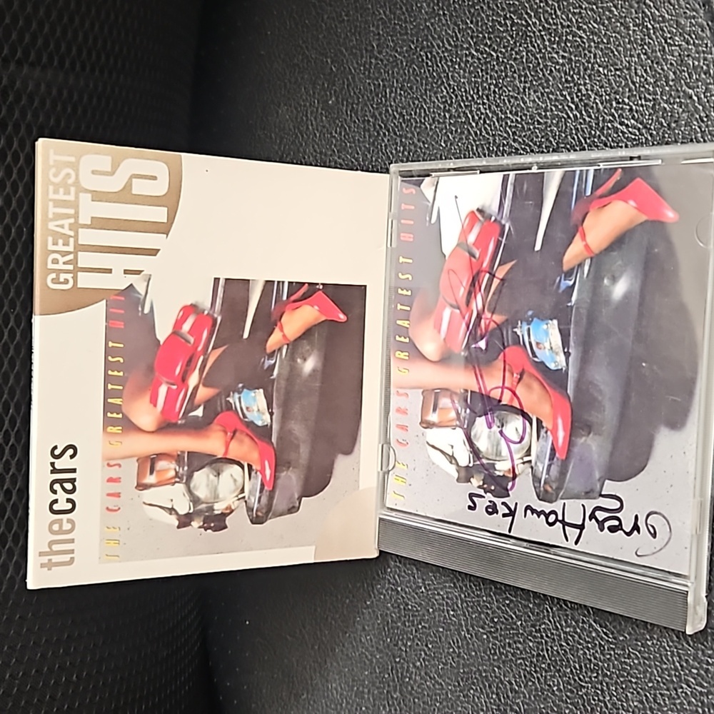 The car's greatest hits CD 2 handsign. Autographs, bye Ellio Easton and greg haw